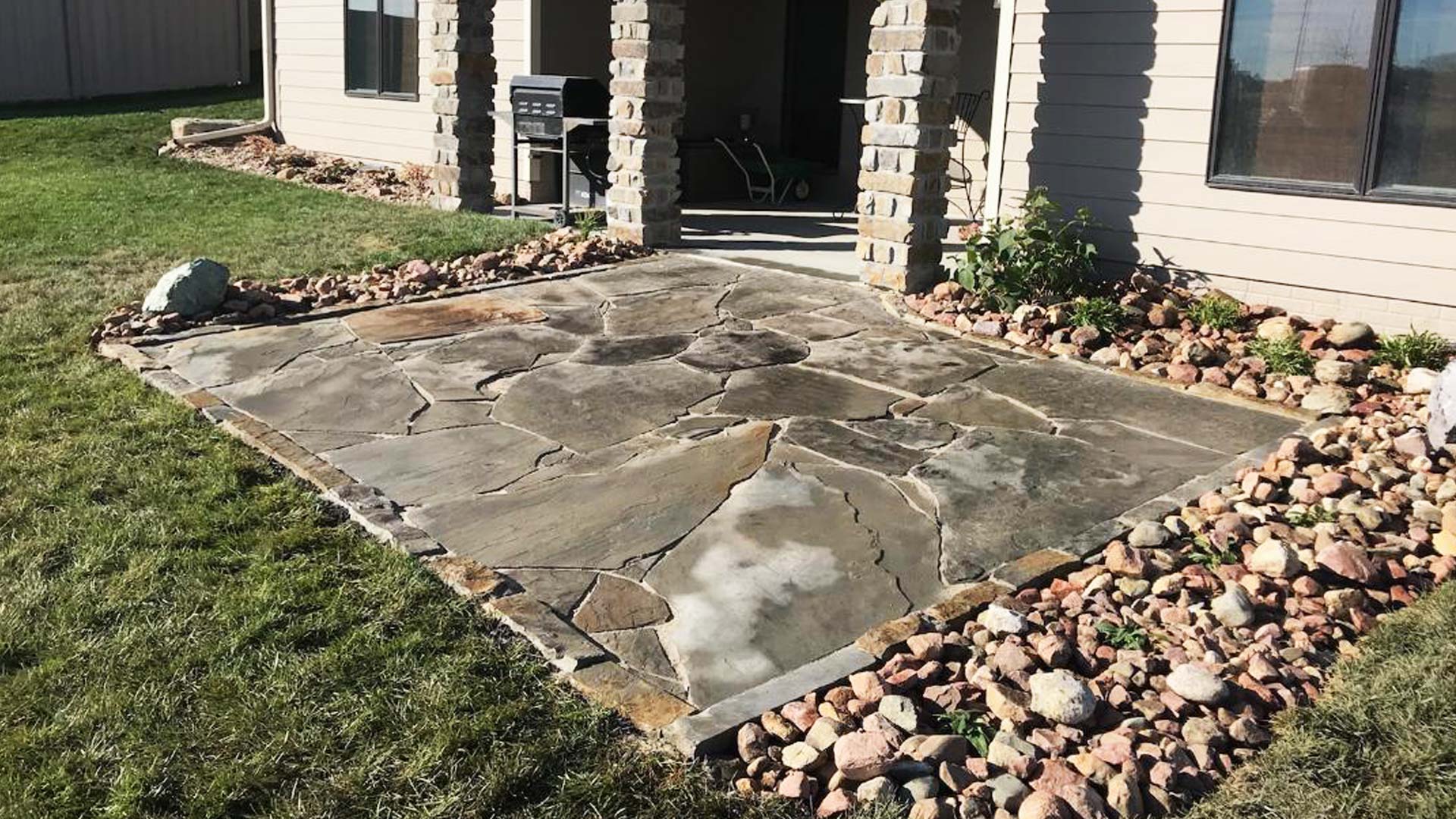 Newly installed flagstone pation in the backyard of a home in Lancaster County.