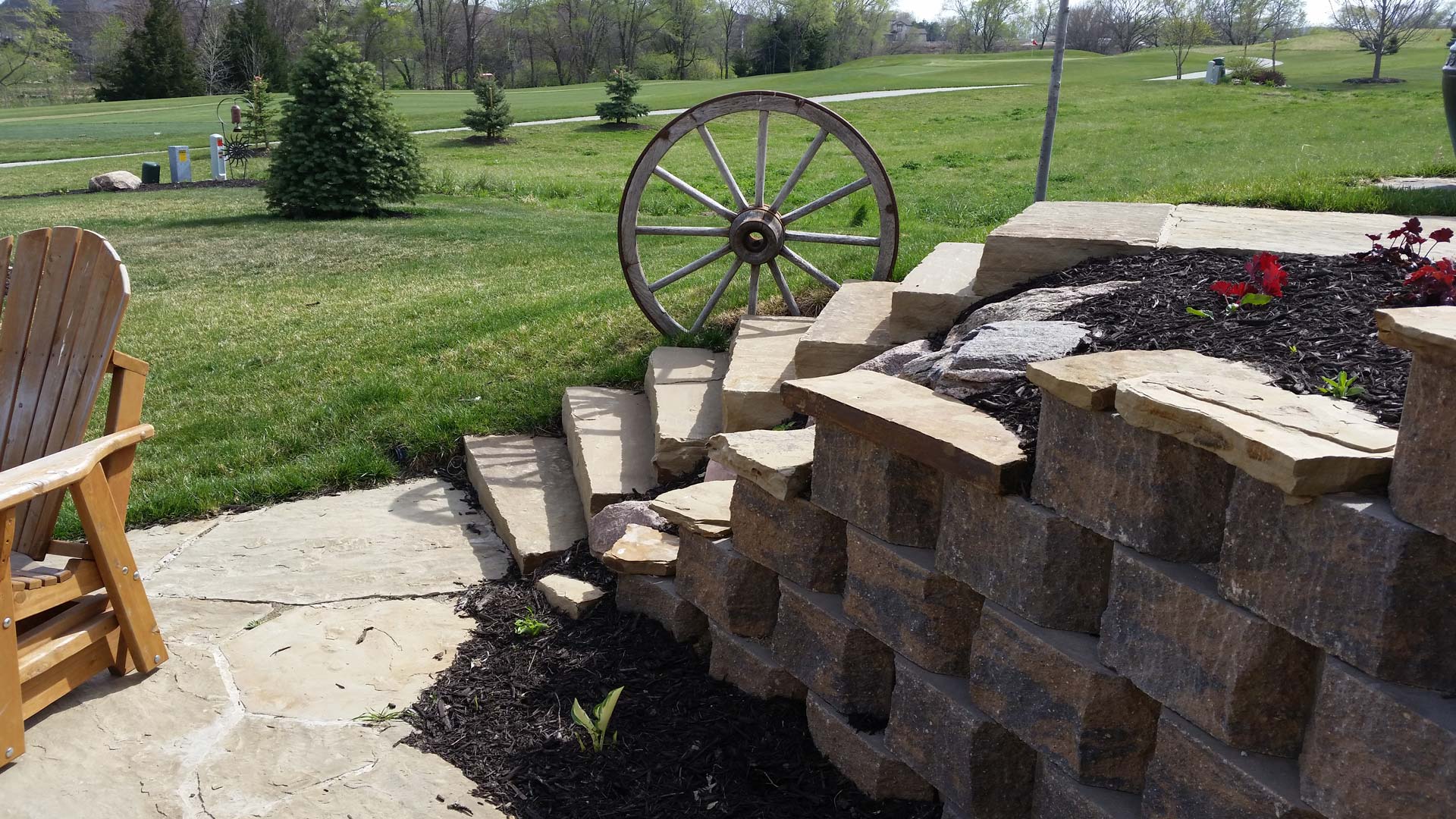 Retaining wall designed and installed with new landscaping at a home in Lancaster.